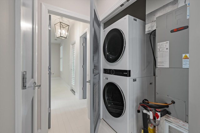 5152 Coral Reef Dr, Johns Island, SC 29455 - washroom featuring estacked washer and dryer and a chandelier