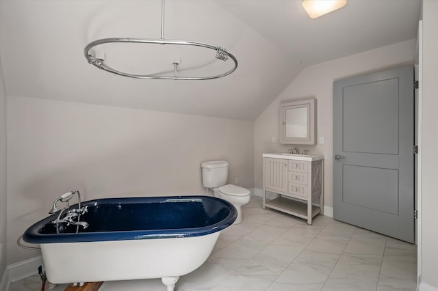 5152 Coral Reef Dr, Johns Island, SC 29455 - bathroom featuring marble finish floors, a freestanding tub, vaulted ceiling, and vanity