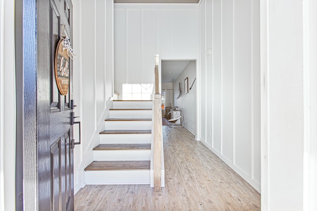 staircase featuring wood finished floors