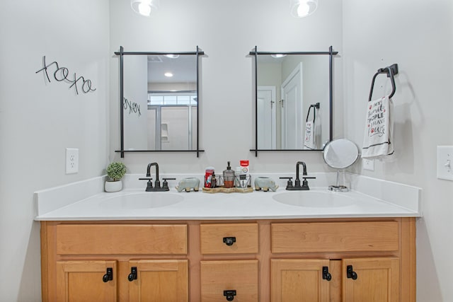 full bath featuring double vanity and a sink