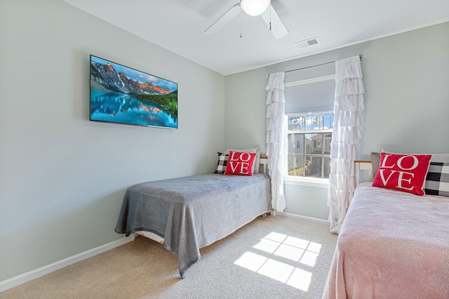 bedroom featuring carpet floors, visible vents, baseboards, and a ceiling fan