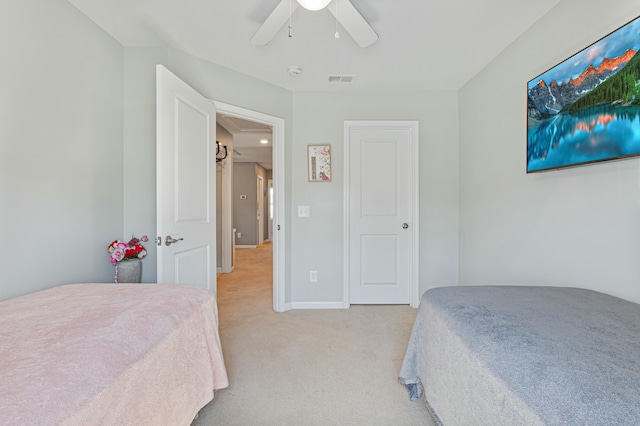 bedroom featuring ceiling fan, light carpet, visible vents, baseboards, and attic access