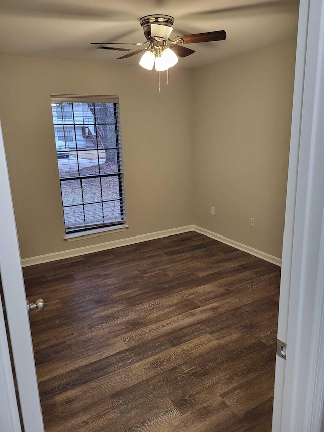 unfurnished room featuring ceiling fan and dark hardwood / wood-style floors