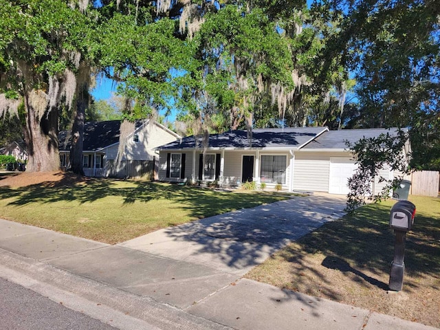 ranch-style home featuring a garage and a front lawn