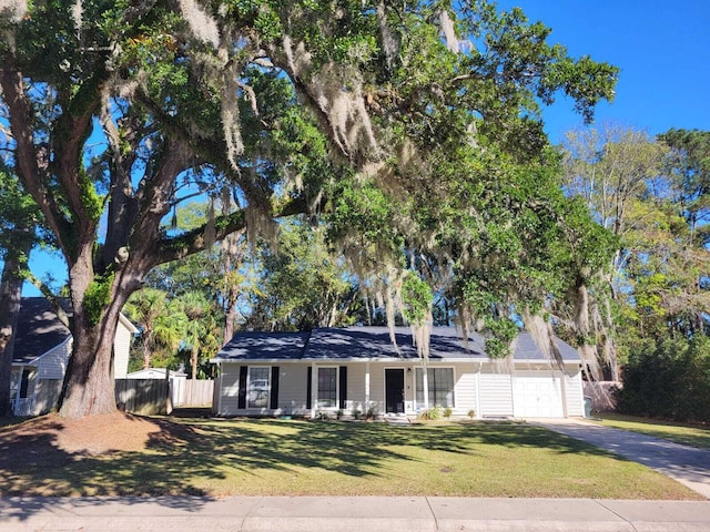 view of front facade with a front lawn and a porch