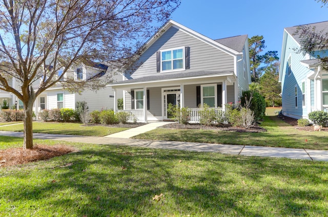 view of front of property featuring a front lawn and covered porch