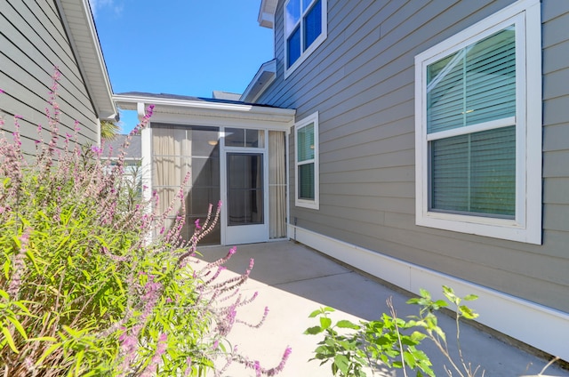 property entrance with a patio