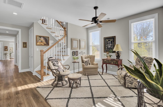 sitting room with hardwood / wood-style flooring, plenty of natural light, and ceiling fan