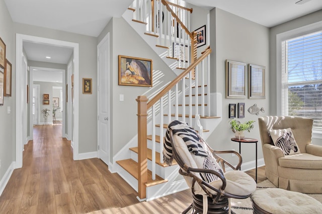 stairway featuring hardwood / wood-style floors