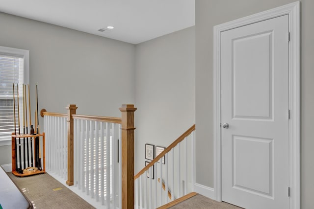 corridor featuring carpet flooring