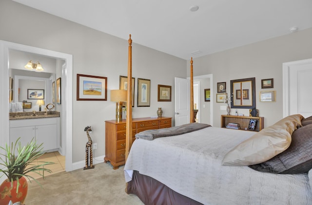 carpeted bedroom featuring connected bathroom