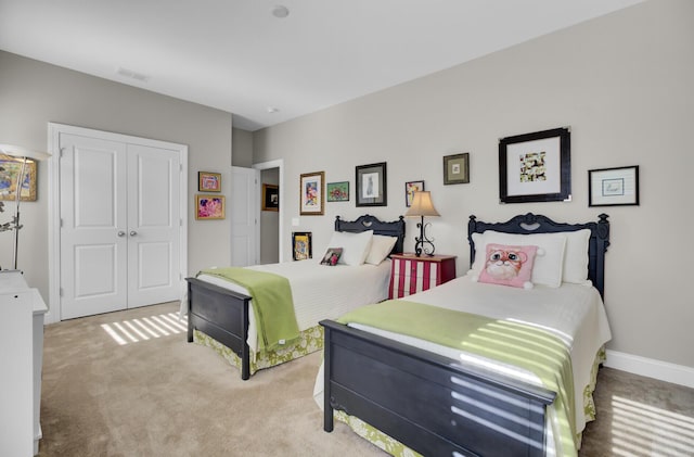 carpeted bedroom with a closet