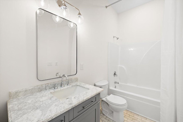 bathroom with toilet, shower / bath combo, and vanity