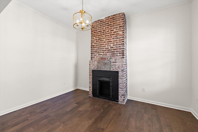 unfurnished living room with baseboards, a chandelier, ornamental molding, and wood finished floors