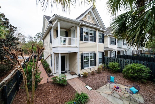 rear view of property with a balcony