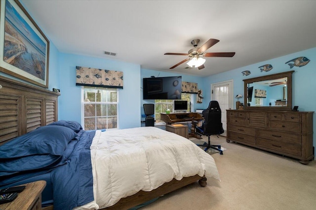 bedroom with light colored carpet and ceiling fan