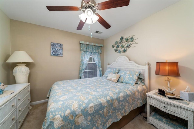 bedroom with light colored carpet and ceiling fan