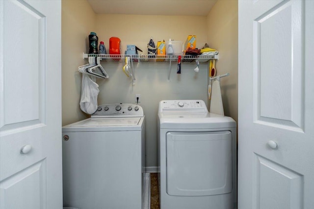 washroom with washing machine and dryer