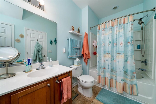 full bathroom with shower / tub combo with curtain, vanity, toilet, and tile patterned floors