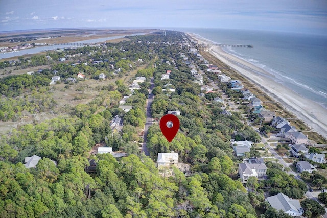 drone / aerial view with a beach view and a water view