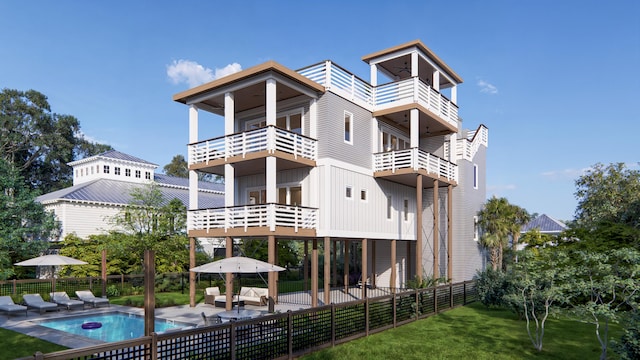 rear view of house featuring fence, a patio, a balcony, a fenced in pool, and a yard
