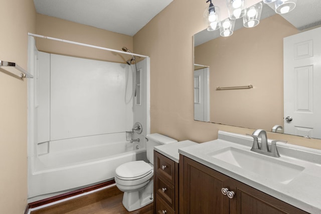 bathroom featuring bathing tub / shower combination, toilet, wood finished floors, and vanity