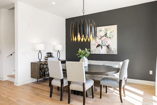 dining area with recessed lighting, stairs, baseboards, and wood finished floors