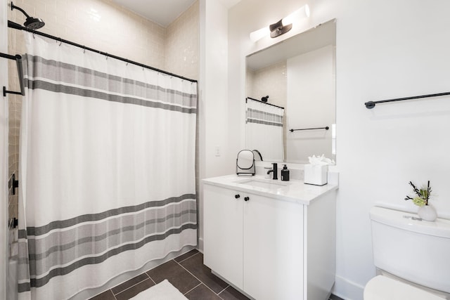 full bathroom with tile patterned floors, vanity, a shower with curtain, and toilet