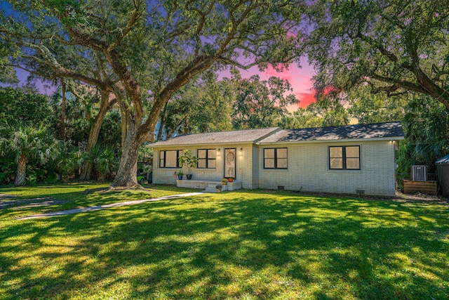 ranch-style house with a yard