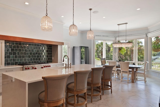 kitchen with plenty of natural light, pendant lighting, and sink