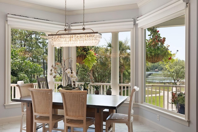 sunroom / solarium featuring a chandelier and a wealth of natural light