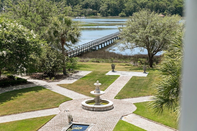 view of nearby features featuring a water view and a yard