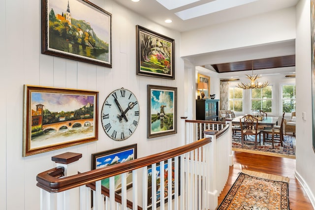 3121 Marshgate Dr, Seabrook Island, SC 29455 - hall featuring a chandelier, a skylight, wood finished floors, and recessed lighting