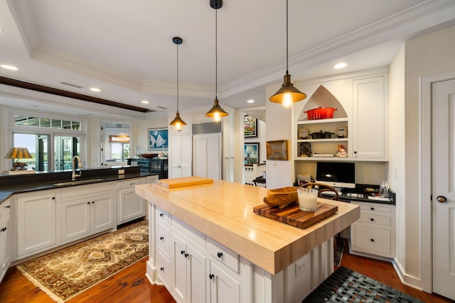 3121 Marshgate Dr, Seabrook Island, SC 29455 - kitchen featuring butcher block countertops, ornamental molding, dark wood-style floors, recessed lighting, and paneled refrigerator