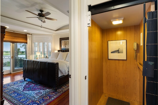 3121 Marshgate Dr, Seabrook Island, SC 29455 - bedroom featuring access to exterior, vaulted ceiling, and wood finished floors