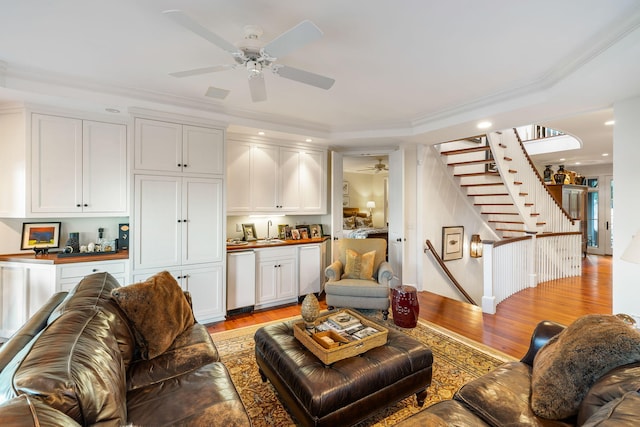 3121 Marshgate Dr, Seabrook Island, SC 29455 - living area featuring ceiling fan, light wood-style flooring, stairs, ornamental molding, and wet bar