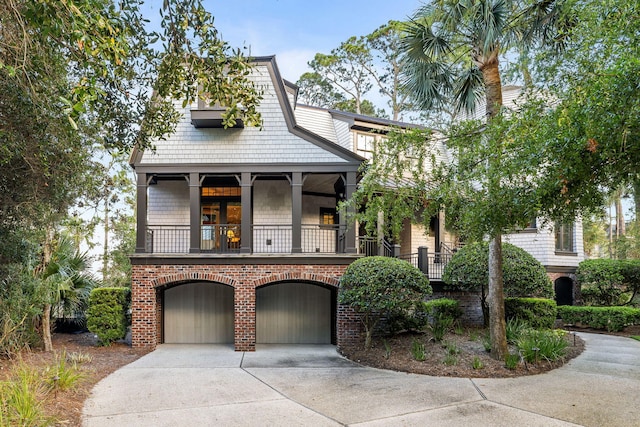 3121 Marshgate Dr, Seabrook Island, SC 29455 - view of front of property with a balcony, driveway, a garage, and brick siding
