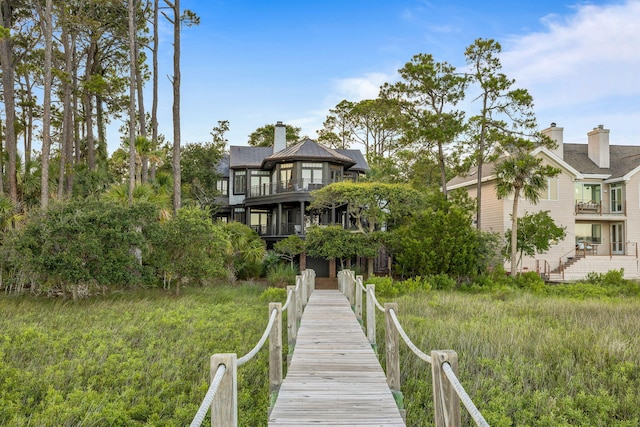 3121 Marshgate Dr, Seabrook Island, SC 29455 - back of house with a chimney and a balcony