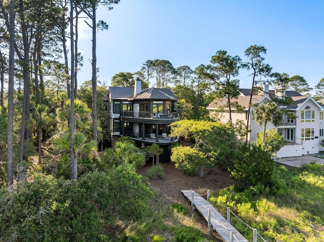 3121 Marshgate Dr, Seabrook Island, SC 29455 - back of property with a chimney and a balcony