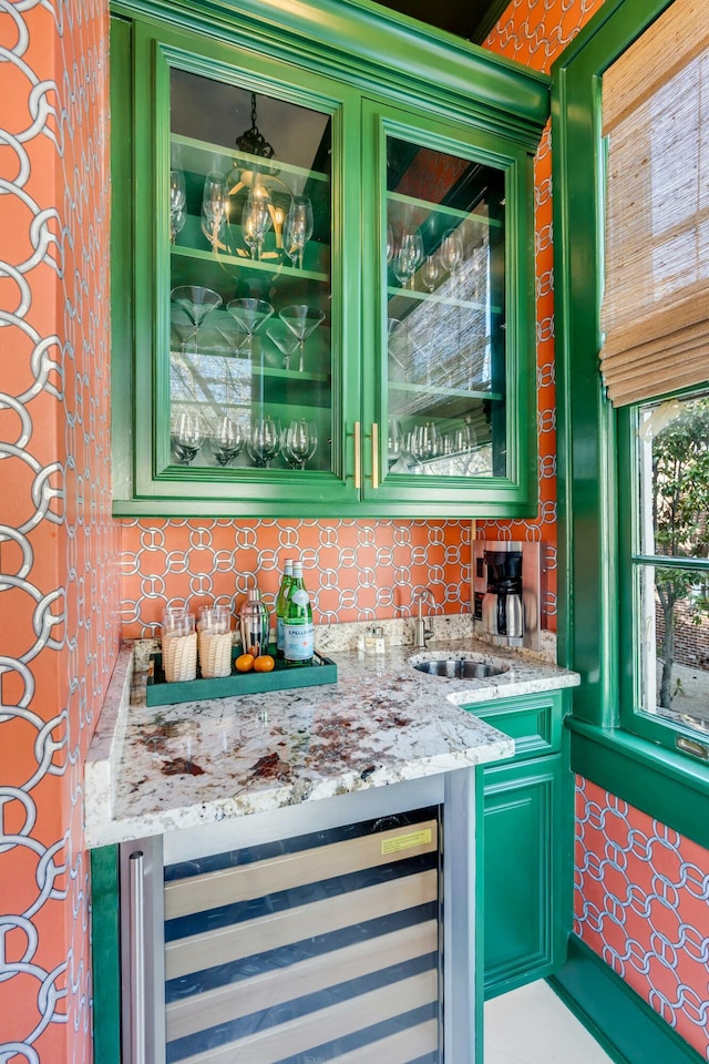 bar with a sink, tasteful backsplash, wine cooler, and indoor wet bar