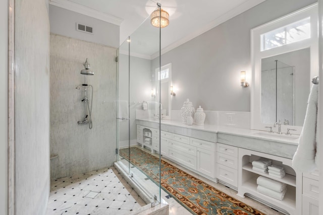 full bathroom featuring a sink, visible vents, ornamental molding, double vanity, and a stall shower