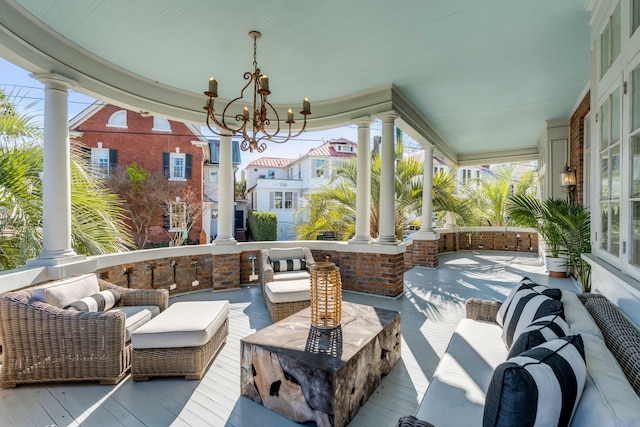 view of patio with a porch and an outdoor living space