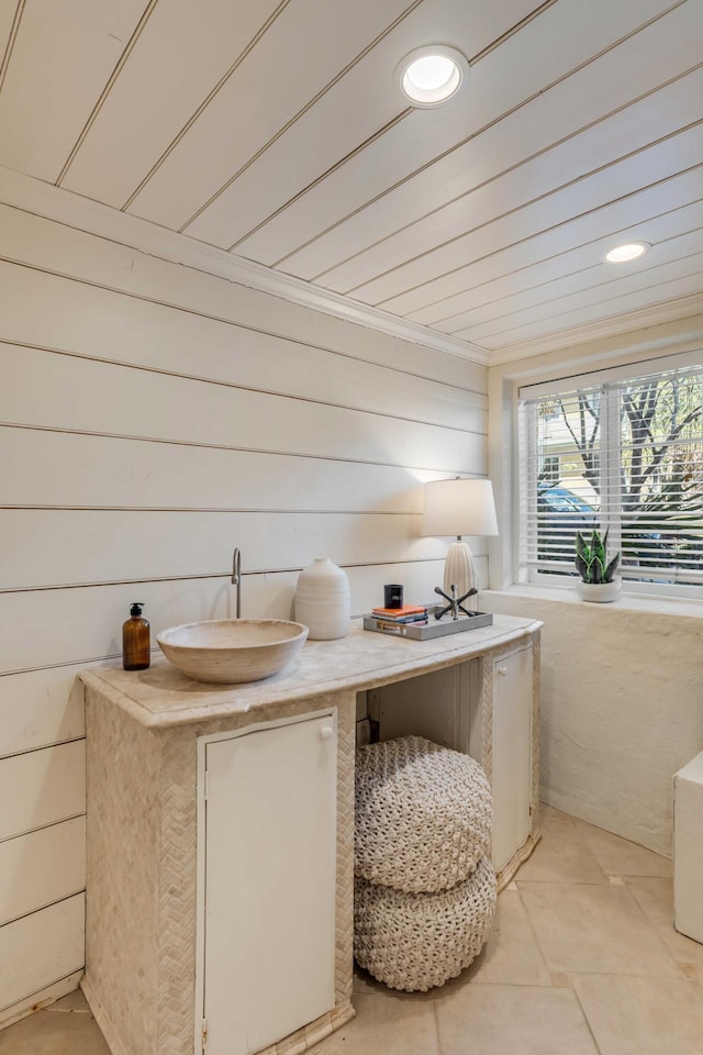 bathroom featuring recessed lighting and a sink