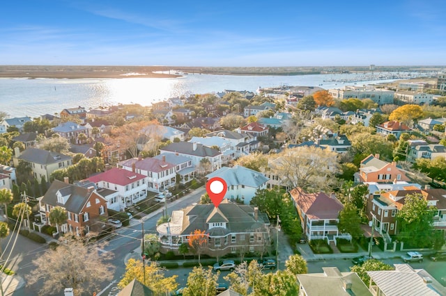 drone / aerial view featuring a residential view and a water view