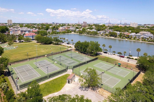 birds eye view of property with a water view and a view of city