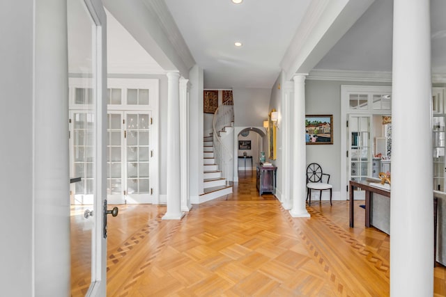 foyer entrance with crown molding, recessed lighting, ornate columns, baseboards, and stairs