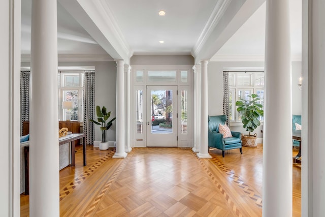 entryway featuring decorative columns, ornamental molding, baseboards, and recessed lighting