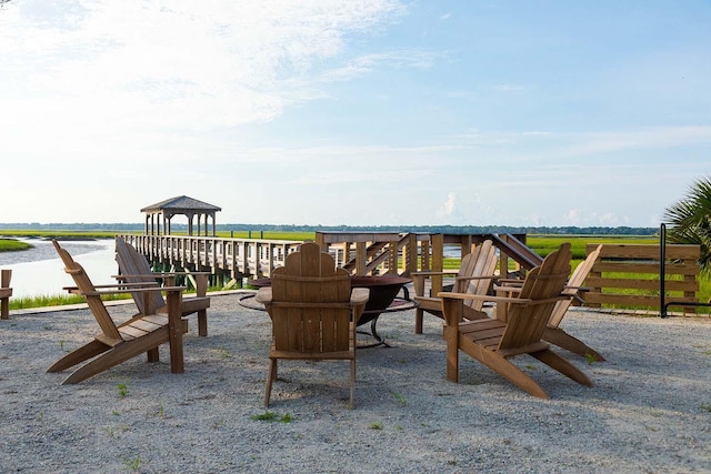 exterior space featuring a gazebo and a water view