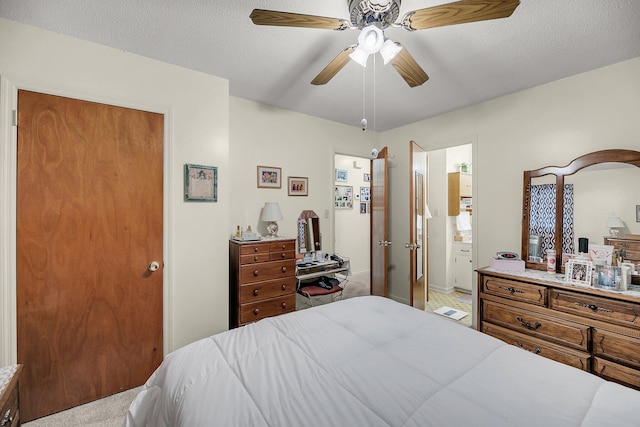 bedroom with a textured ceiling and a ceiling fan