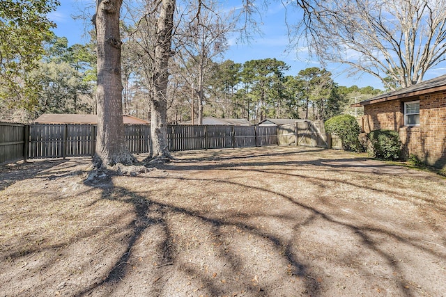 view of yard featuring a fenced backyard